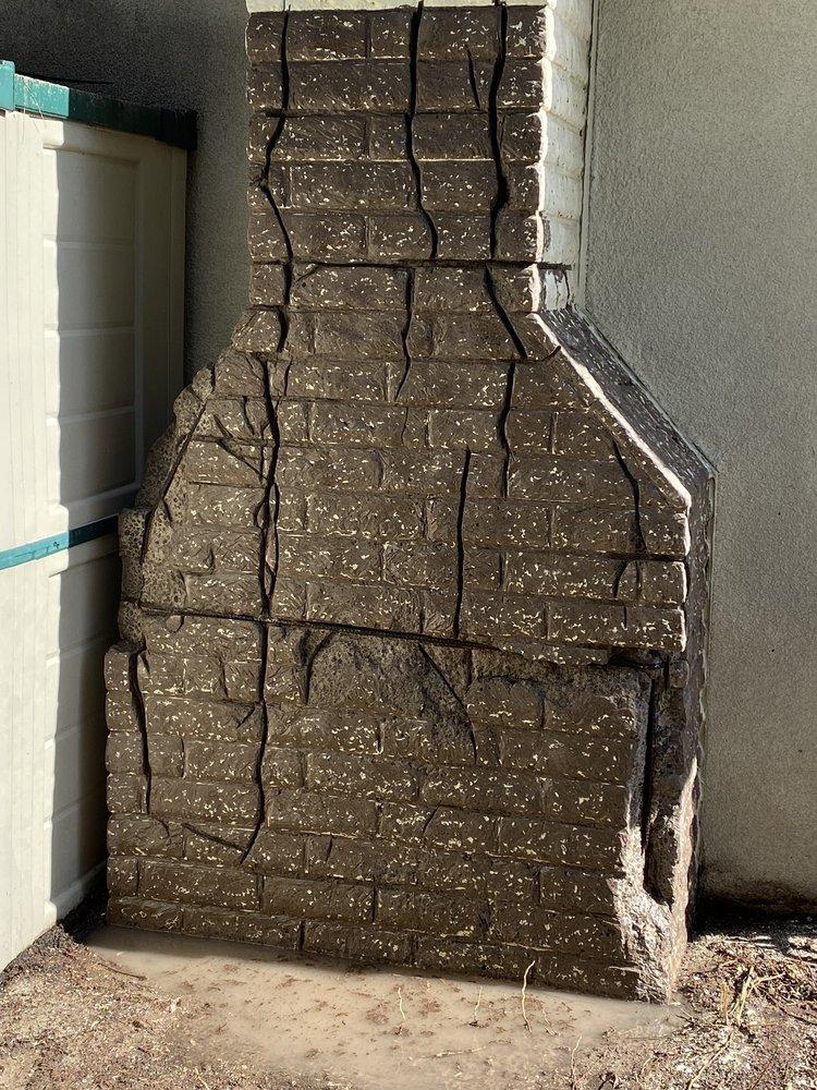 Chimney exterior with deep, extensive cracking throughout the masonry veneer