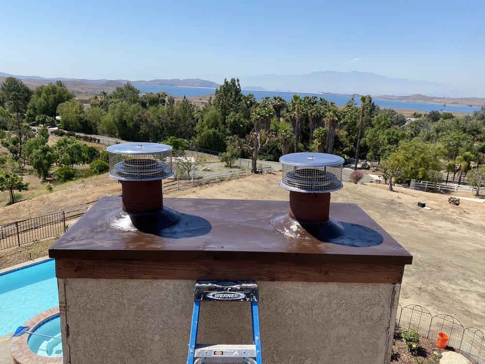 New chase covers on a pair of chimneys overlooking an open valley