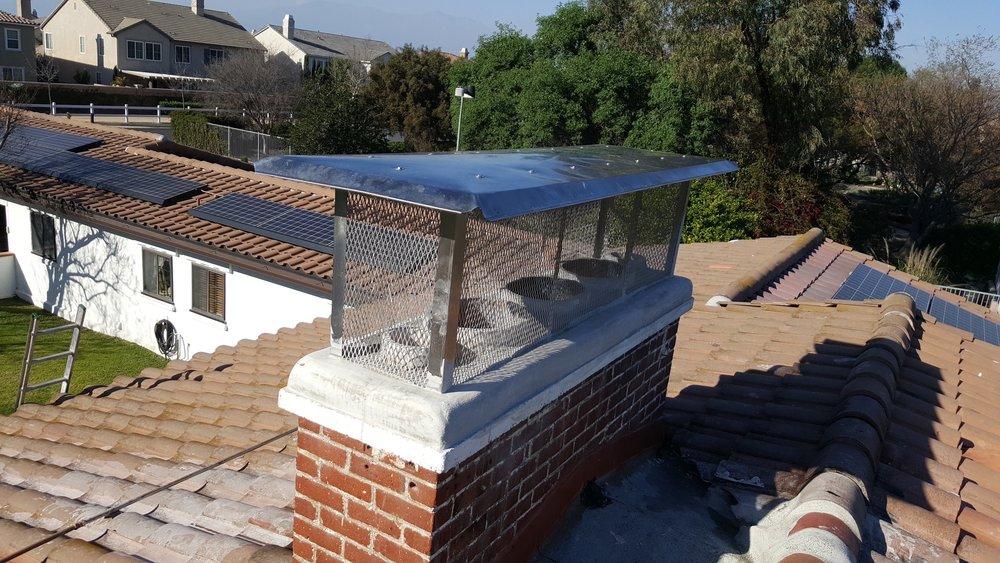 Replacement chimney crown and cap finished on a tile roof